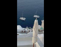 Man follow woman blue dress walk Santorini