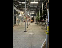 Construction man do push ups on street