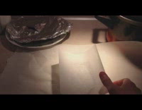 Baking paper wont stay over hot bread