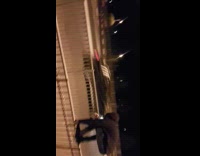 Guy jumps from gate onto another gate and face plants into the sidewalk