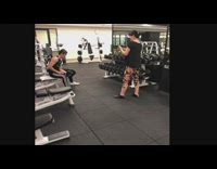 Mom photographs son lift weights indoor gym 