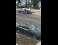 Girl on skateboard catches blue graduation cap