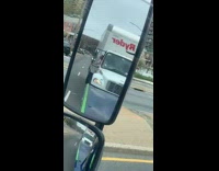 Guy brushes teeth in truck 