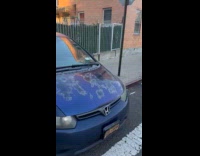 Cars street parked and occupies the sidewalk