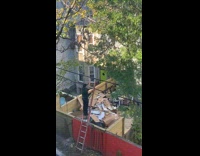 Collab WINY - Man climb on ladder on electric cables - red wall