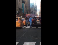 Man wears blue suit with cloud print