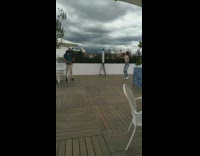 Woman white crop top tiktok dance on the terrace