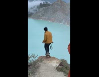 Yellow jacket cliff edge blue water