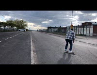 Guy jumps skateboard gets caught on rock 