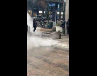 Thick smoke seeps out from the sewer