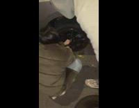 Passengers replace tire of uber driver car while driver smokes