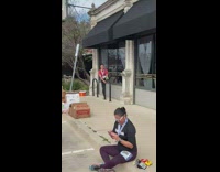 Guy poses with bicycle rack