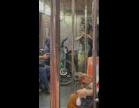 Guy moves hands green goggles hat 