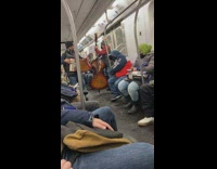 Mariachi band playing live music on subway