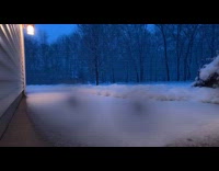 Snow covers backyard in time lapse video