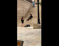 Cowboy black sleeves sit hold hat stairs