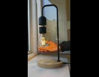 Floating lightbulb spins around lamp design magnetic
