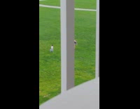 Girl walks backwards films baby walking grass 