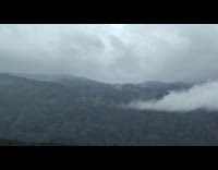 Submitter drives by beautiful mountains and clouds