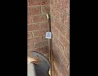 Metal spoon taped to broken shovel 