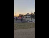 Girl on pedestrian lane police car obelisk