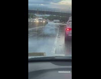 Drive along the highway with flood at day 