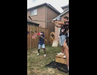 Guy blindfold swings stick pinata hits friend 