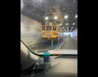 School bus drives with smoke under tunnel 