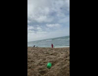 Woman red flowy dress beach jump