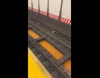 Dirty orange puddle on the subway railway