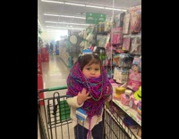 Guy puts lots of necklace on sister