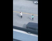 Man white polo dance tiktok video empty street