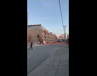 Ballerina guy poses by construction site