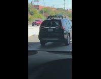Collab Kook Of The Day - Honda CRV with surfboard string hanging from back of car 
