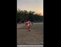 Man plays and carries kid towards ball