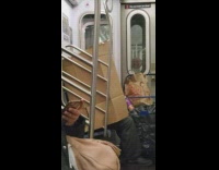 Person on subway cardboard wall