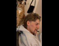 Man smells stinky cat 