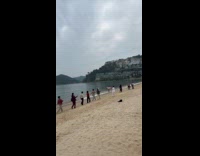 Elder women walks at beach for video