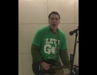 Collab Subway Creatures - man green shirt singing playing guitar
