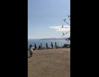 5 Women brooms jump mountain background