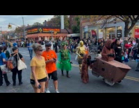 Halloween parade on street crowd star wards C 3PO