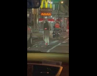 Woman ride electric scooter LED screen backpack