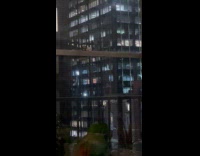 Collab WINY - Lights and sparks seen through building window