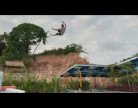 Black shorts guy water slide front flip