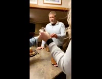 Girl takes shot with parents 