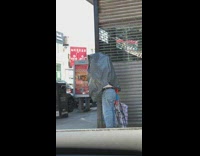 Guy garbage bag over face and body 