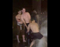 Men take bath at open fire hydrant