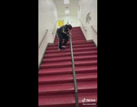 Guy smells black rail red stairs after slide
