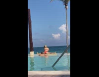 Woman hat bikini leg split on pool