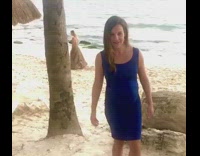 Blue dress pregnant lady beach straw roof 